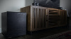 Klipsch-Cinema-600-with-wireless-subwoofer-on-an-entertainment-center-desktop